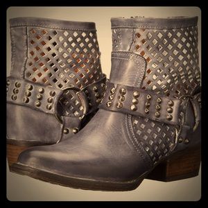 Distressed harness ankle boots
